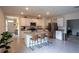Spacious kitchen featuring a center island with seating and modern stainless steel appliances at 412 Lady Bella Pl, Deland, FL 32724