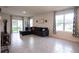 Spacious living room with tile flooring, large windows, and sliding glass door at 412 Lady Bella Pl, Deland, FL 32724