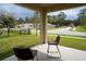 Inviting covered patio with comfortable seating and serene view of the neighborhood at 412 Lady Bella Pl, Deland, FL 32724