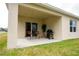 Enjoy this covered patio with room for seating and a grill, perfect for outdoor relaxation and entertaining at 412 Lady Bella Pl, Deland, FL 32724