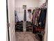 Organized walk-in closet with ample hanging space and shoe racks for optimal storage at 412 Lady Bella Pl, Deland, FL 32724