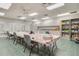 Craft room with a large table and storage cabinets for art supplies at 4712 St Andrews Arc, Leesburg, FL 34748