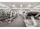 Well-equipped fitness center with weights, machines and treadmills perfect for staying active and healthy at 4712 St Andrews Arc, Leesburg, FL 34748