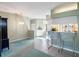Open concept kitchen and living area with breakfast bar and tiled floors at 4712 St Andrews Arc, Leesburg, FL 34748