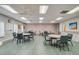 Spacious meeting room with tables and comfortable seating at 4712 St Andrews Arc, Leesburg, FL 34748