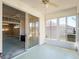 Spacious enclosed patio featuring sliding glass doors that lead to an inside living room and offer scenic backyard views at 4712 St Andrews Arc, Leesburg, FL 34748