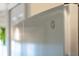 Close-up shot of a GE stainless steel refrigerator, showcasing its sleek design and modern features at 4712 St Andrews Arc, Leesburg, FL 34748