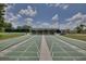 Community shuffleboard courts ready for play, set in a well maintained outdoor area with seating at 4712 St Andrews Arc, Leesburg, FL 34748