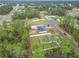 Aerial view of a property with a fenced backyard, neighborhood, and surrounding trees at 4923 Sw 166Th Loop, Ocala, FL 34473