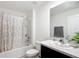 Clean bathroom featuring a shower-tub combo, a toilet, and a vanity with a sink and a mirror at 4923 Sw 166Th Loop, Ocala, FL 34473