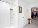 Walk-in shower features a wall niche for storage, and leads to the closet at 4923 Sw 166Th Loop, Ocala, FL 34473