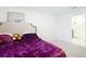 Cozy bedroom featuring a plush bed and a bathroom entrance at 4923 Sw 166Th Loop, Ocala, FL 34473