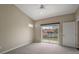 Bedroom with carpeted floors, ceiling fan, and sliding glass doors leading to a balcony at 5359 Compass Pt, Oxford, FL 34484