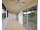 This screened-in patio features large sliding glass doors at 5359 Compass Pt, Oxford, FL 34484