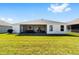 This home boasts a spacious backyard with a screened-in patio, perfect for entertaining at 5978 Conley Ct, The Villages, FL 32163
