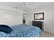 Bedroom featuring a window, carpet flooring, double closets and ensuite access at 5978 Conley Ct, The Villages, FL 32163