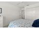 Bright bedroom with carpet flooring, double closets and ensuite access at 5978 Conley Ct, The Villages, FL 32163