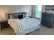 Cozy bedroom featuring a comfortable bed, classic decor, and a bright window offering natural light at 5978 Conley Ct, The Villages, FL 32163