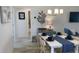 Elegant dining room with a stylish table setting, decorative lighting, and seamless access to the living areas at 5978 Conley Ct, The Villages, FL 32163