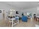Open-concept living room with contemporary furnishings and a view to the lanai at 5978 Conley Ct, The Villages, FL 32163