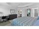 The bedroom is spacious and bright, with a desk, en suite bathroom, and carpet flooring at 5978 Conley Ct, The Villages, FL 32163