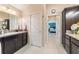 Bathroom featuring tile floor and granite countertops at 6083 Delphina Loop, The Villages, FL 32163