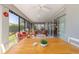 Relaxing lanai with ceiling fans, sliding doors and comfortable seating overlooking the landscaped backyard at 6083 Delphina Loop, The Villages, FL 32163