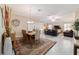 Living room and dining area with tile floors and lots of natural light at 6083 Delphina Loop, The Villages, FL 32163