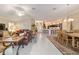 Bright and airy living room adjoining an open kitchen and breakfast area with seating at 6083 Delphina Loop, The Villages, FL 32163