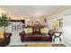 Living room with leather sofa opening to kitchen and dining area at 6083 Delphina Loop, The Villages, FL 32163