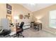 Well-organized office space with multiple workstations, carpet floors, and a vaulted ceiling for a productive work environment at 6083 Delphina Loop, The Villages, FL 32163