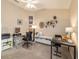 Well-organized office space with multiple workstations, carpet floors, and a vaulted ceiling for a productive work environment at 6083 Delphina Loop, The Villages, FL 32163