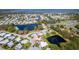 Picturesque aerial shot of a lakeside community with houses nestled along the waterways and lush greenery at 710 Dolphin Dr, Tavares, FL 32778