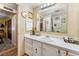 Bathroom featuring a single sink vanity, and decorative wallpaper at 710 Dolphin Dr, Tavares, FL 32778