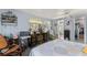 This is a bright bedroom with a ceiling fan, closet access, and a seating area at 710 Dolphin Dr, Tavares, FL 32778
