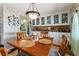 Cozy dining room featuring built-in storage and a classic chandelier at 710 Dolphin Dr, Tavares, FL 32778