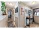 Hallway with wood flooring and decorative accents, leading to living spaces at 710 Dolphin Dr, Tavares, FL 32778