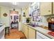 Efficient kitchen featuring a stainless-steel sink and bright lighting at 710 Dolphin Dr, Tavares, FL 32778