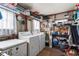 Laundry room featuring a washer, dryer and storage shelves at 710 Dolphin Dr, Tavares, FL 32778