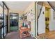 Inviting porch featuring eclectic decorations and entry into the home at 710 Dolphin Dr, Tavares, FL 32778