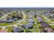 Community aerial view with lush greenery, manicured lawns, and a peaceful residential setting at 717 Robin Ct, Kissimmee, FL 34759