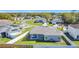 Aerial view of the backyard showcasing the patio, privacy fence, and proximity to the neighborhood at 717 Robin Ct, Kissimmee, FL 34759