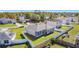 Aerial view of backyard showcasing the fence that surrounds the house and the well-maintained lawn at 717 Robin Ct, Kissimmee, FL 34759