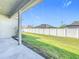 Expansive backyard with well-maintained grass, white vinyl fence for privacy and outdoor enjoyment at 717 Robin Ct, Kissimmee, FL 34759
