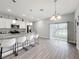 Open layout kitchen and dining area with sliding glass doors to the backyard at 717 Robin Ct, Kissimmee, FL 34759
