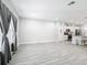 An expansive living space leading into the kitchen, with abundant natural light at 717 Robin Ct, Kissimmee, FL 34759