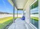Covered patio provides an outdoor space for entertaining and overlooking the green backyard at 717 Robin Ct, Kissimmee, FL 34759