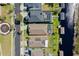Aerial view of residences, complete with swimming pools and private boat docks on a sunny day at 724 Barefoot Bay Loop, Groveland, FL 34736