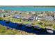 Aerial view of waterfront homes with private docks offering a serene lakeside lifestyle at 724 Barefoot Bay Loop, Groveland, FL 34736