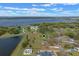 Aerial view of the property with lake, and waterfront with pin highlighting the location at 7729 Lake Andrea Cir, Mount Dora, FL 32757